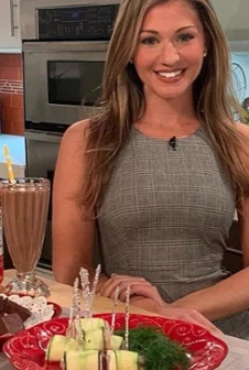 Maryann preparing food during a TV kitchen segment